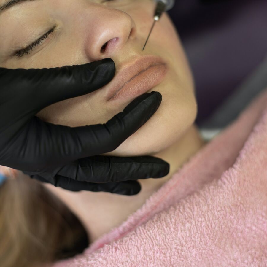 Woman being injected with lip filler