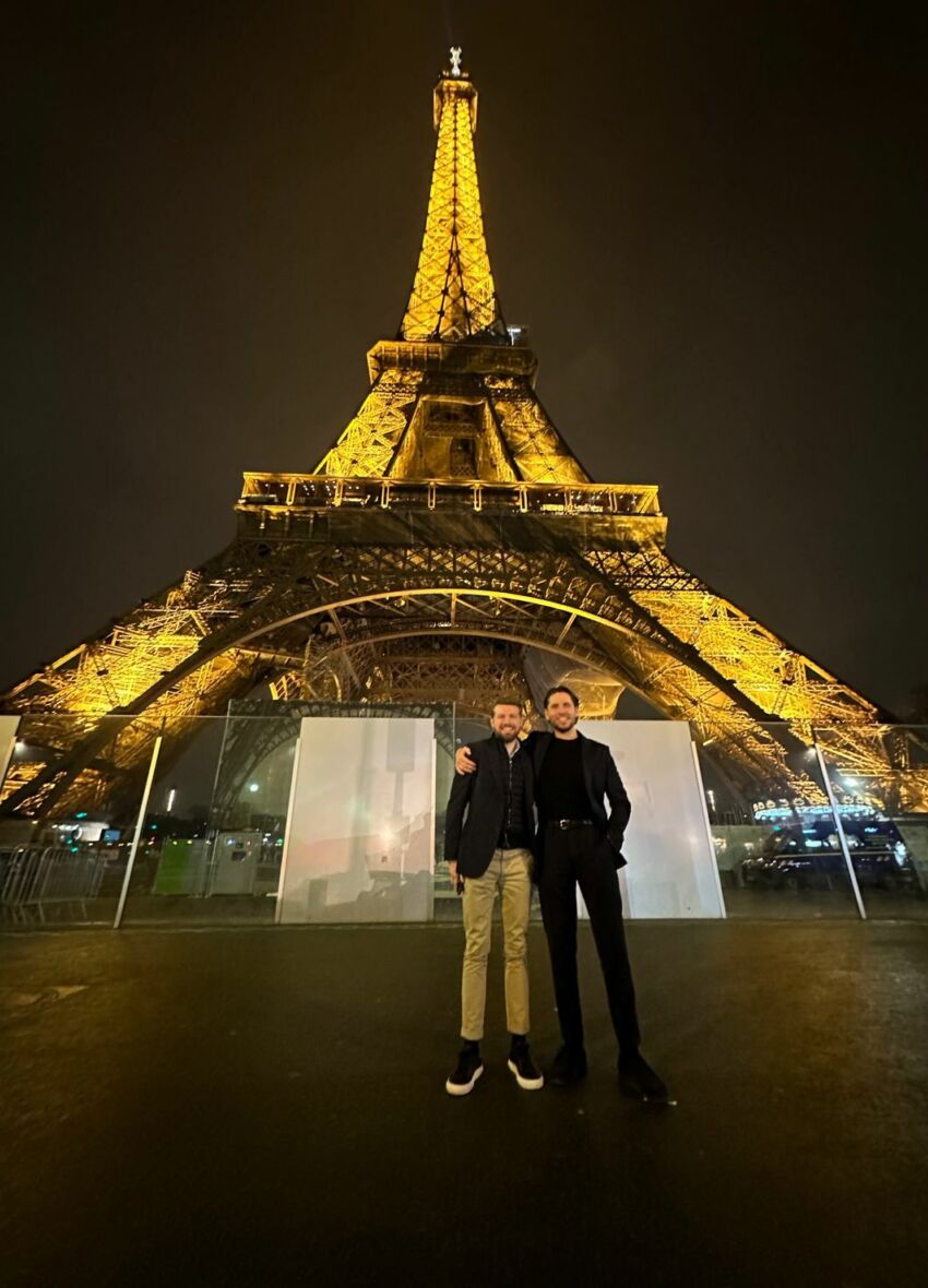 Ross and Vahn standing in front of the Eiffel Tower