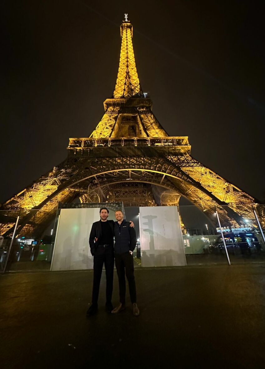 Ross and Jacob standing in front of the Eiffel Tower